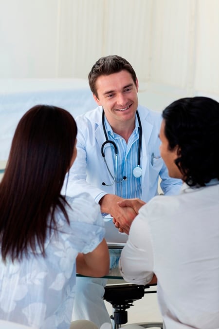 image of a physician talking with a couple