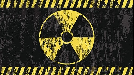 A yellow and black colored radioactive hazard symbol