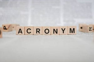 blocks spelling out acronym